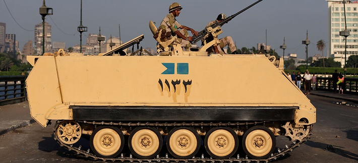 An Egyptian army soldier guards an entrance to Tahrir Square An Egyptian army soldier guards an entrance to Tahrir Square