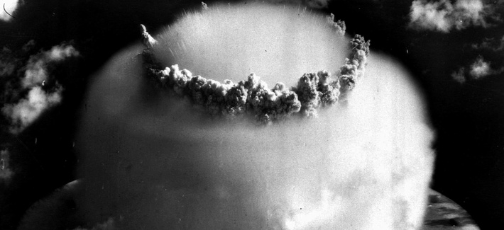 The mushroom cloud of an atomic bomb test at Bikini atoll swamps ships, in 1946. The mushroom cloud of an atomic bomb test at Bikini atoll swamps ships, in 1946.