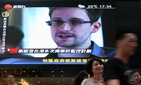 A photograph of NSA leaker Edward Snowden on a screen in Hong Kong