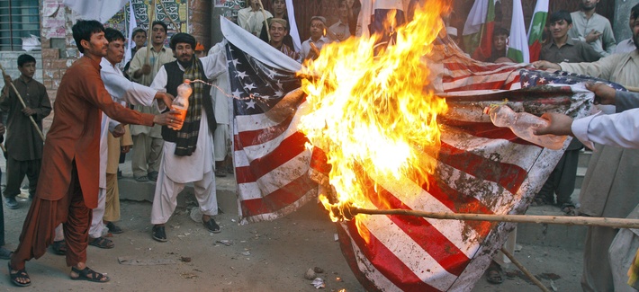 Protestors from a religious party burn a U.S. flag during an anti-NATO protest in July 2012 Protestors from a religious party burn a U.S. flag during an anti-NATO protest in July 2012