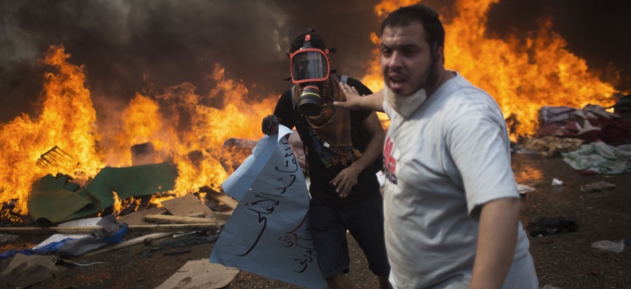Supporters of Egypt's former president Mohammad Morsi run from security forces firing rounds of weapons at them Supporters of Egypt's former president Mohammad Morsi run from security forces firing rounds of weapons at them