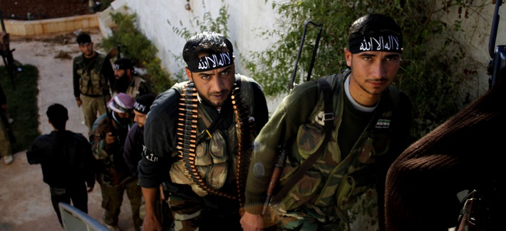 A group of Syrian rebels gather their weapons before confronting government troops in Aleppo A group of Syrian rebels gather their weapons before confronting government troops in Aleppo