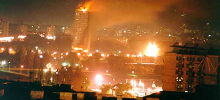 A building on fire after a NATO bombing run in the former Yugoslavia A building on fire after a NATO bombing run in the former Yugoslavia