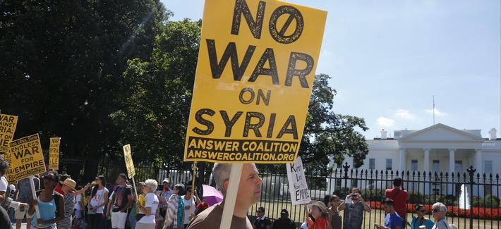 An anti-war protestor stands outside the White House An anti-war protestor stands outside the White House