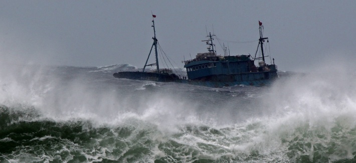 A boat is thrashed by waves near Jeju Island, which is near Sokora Island A boat is thrashed by waves near Jeju Island, which is near Sokora Island