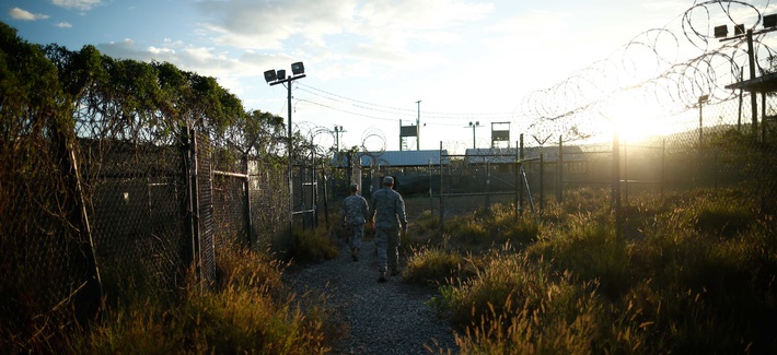 A soldier walks through Camp X-Ray, one of the abandoned facilities at Guantanamo Bay A soldier walks through Camp X-Ray, one of the abandoned facilities at Guantanamo Bay