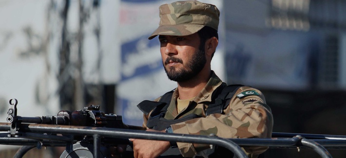 A Pakistani soldier stands guard during a curfew in Rawalpindi, Pakistan A Pakistani soldier stands guard during a curfew in Rawalpindi, Pakistan