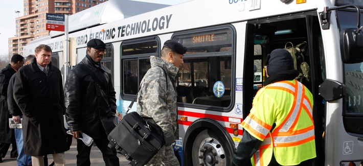 Pentagon employees board a bus near the Pentagon metro station Pentagon employees board a bus near the Pentagon metro station