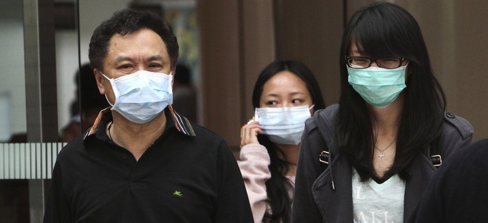 People cover up to protect from bird flu in Taipei, Taiwan, Friday, Apr. 26, 2013. People cover up to protect from bird flu in Taipei, Taiwan, Friday, Apr. 26, 2013.