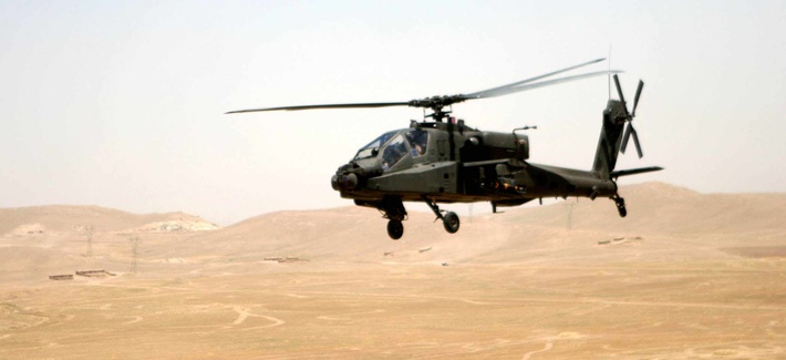 An Apache attack helicopter flies a route between Tall'Afar and Mosul, Iraq, in June 2006. An Apache attack helicopter flies a route between Tall'Afar and Mosul, Iraq, in June 2006.