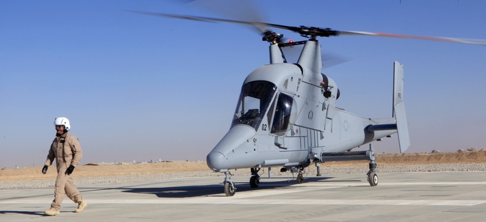 A K-MAX pilotless freight helicopter sits at Camp Dwyer in Afghanistan’s Helmand province, in Dec. 2011. The unmanned cargo helicopter flies missions to remote outposts above roadside bombs. A K-MAX pilotless freight helicopter sits at Camp Dwyer in Afghanistan’s Helmand province, in Dec. 2011. The unmanned cargo helicopter flies missions to remote outposts above roadside bombs.