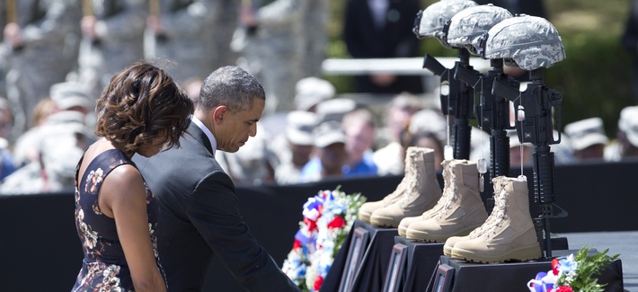 President Barack Obama and First Lady Michelle Obama pay their respects during a memorial ceremony at Fort Hood on Wednesday. President Barack Obama and First Lady Michelle Obama pay their respects during a memorial ceremony at Fort Hood on Wednesday.