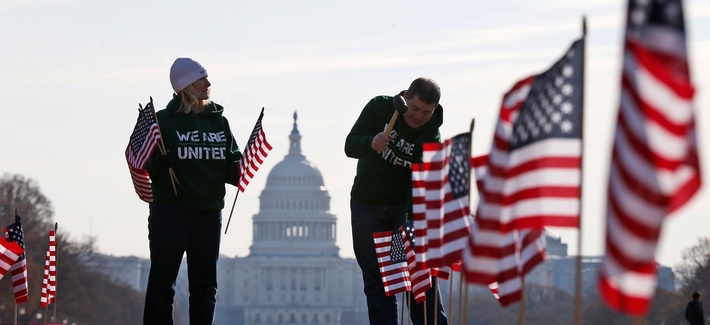Two military veterans with the Iraq and Afghanistan Veterans of America (IAVA) placing 1892 flags on the National Mall to represent veterans and service members who have died by suicide in 2014 Two military veterans with the Iraq and Afghanistan Veterans of America (IAVA) placing 1892 flags on the National Mall to represent veterans and service members who have died by suicide in 2014