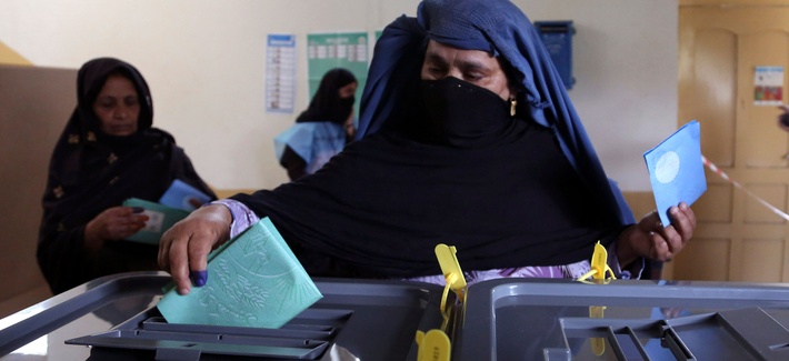 An Afghan woman casts her vote at a polling station in Jalalabad east of Kabul, Afghanistan, Saturday, April 5, 2014. An Afghan woman casts her vote at a polling station in Jalalabad east of Kabul, Afghanistan, Saturday, April 5, 2014.