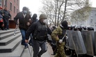 Pro-Russian activists leaving the office of the regional prosecutor in Donetsk, Ukraine