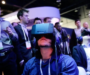 An attendee at the International Consumer Electronics Show trying on the Oculus headset An attendee at the International Consumer Electronics Show trying on the Oculus headset