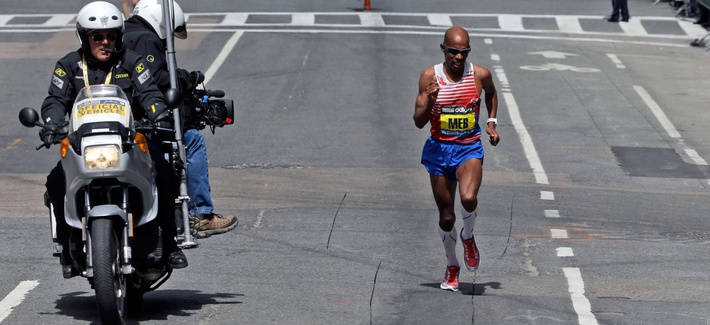 Meb Keflezighi runs the final few blocks before winning the 118th Boston Marathon Monday, April 21, 2014 in Boston. Meb Keflezighi runs the final few blocks before winning the 118th Boston Marathon Monday, April 21, 2014 in Boston.