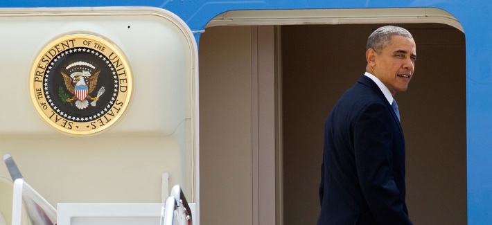 President Obama looking back before departing on Air Force One for his four country Asia trip President Obama looking back before departing on Air Force One for his four country Asia trip