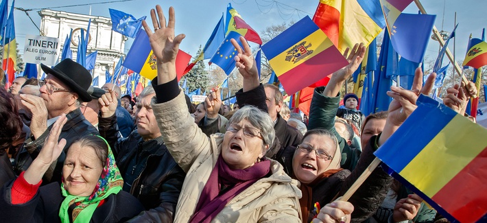 Moldovan women change pro-European Union slogans in Chisinau, Moldova, last November. Moldovan women change pro-European Union slogans in Chisinau, Moldova, last November.