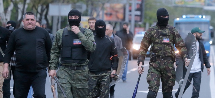 Masked pro-Russian activists walk down the streets of Donetsk, Ukraine on April 28. Masked pro-Russian activists walk down the streets of Donetsk, Ukraine on April 28.