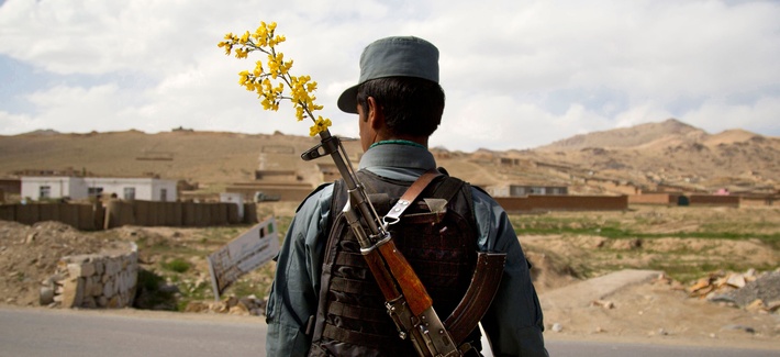An Afghan National Police Officer stands by a checkpoint on the outskirts of Maidan Shahr, Wardak province, Afghanistan An Afghan National Police Officer stands by a checkpoint on the outskirts of Maidan Shahr, Wardak province, Afghanistan