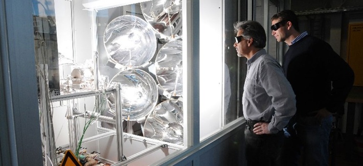 Two men looking at the Solar Jet reactor at work Two men looking at the Solar Jet reactor at work