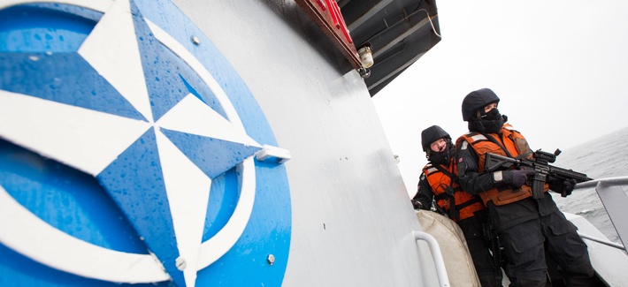 Two Norwegian sailors onboard the Norwegian support vessel Valkyrien pose for photographers during a deployment in the Baltic Sea on April 23, 2014. Two Norwegian sailors onboard the Norwegian support vessel Valkyrien pose for photographers during a deployment in the Baltic Sea on April 23, 2014.