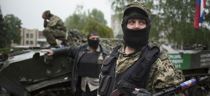 Pro-Russian gunmen guard the central square of Slovyansk, eastern Ukraine, Friday, May 2, 2014. Pro-Russian gunmen guard the central square of Slovyansk, eastern Ukraine, Friday, May 2, 2014.