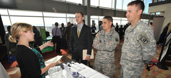 Job-seeking veterans and service members speak with a prospective employer at the Hiring Our Heroes DC job fair at Nationals Park on Dec. 5, 2012 in Washington. Job-seeking veterans and service members speak with a prospective employer at the Hiring Our Heroes DC job fair at Nationals Park on Dec. 5, 2012 in Washington.