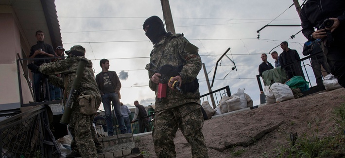 Pro-Ukrainian militiamen stand guard near a barricade in Slovyansk, Ukraine on May 4, 2014. Pro-Ukrainian militiamen stand guard near a barricade in Slovyansk, Ukraine on May 4, 2014.