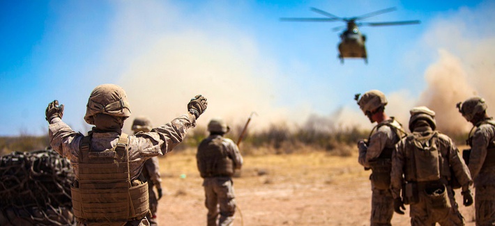 Marines with the 2nd Combat Logistics Battalion direct an Army CH-47 Chinook helicopter during a Network Integration Exercise at Fort Bliss, Texas Marines with the 2nd Combat Logistics Battalion direct an Army CH-47 Chinook helicopter during a Network Integration Exercise at Fort Bliss, Texas