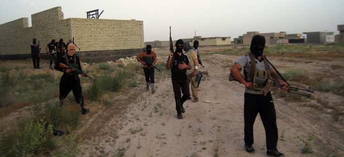 Masked anti-government gunmen patrol the streets in Fallujah, Iraq on April 28, 2014. Masked anti-government gunmen patrol the streets in Fallujah, Iraq on April 28, 2014.
