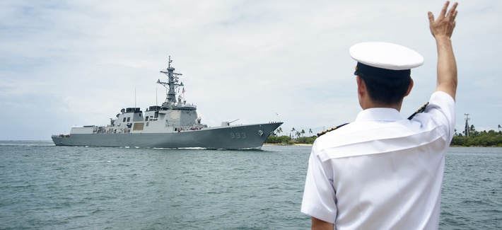 PEARL HARBOR - Republic of Korea Navy Capt. Yong Mo Yang, defense attaché in Hawaii, waves to a Korean destroyer arriving at Joint Base Pearl Harbor-Hickam for the Rim of the Pacific, or RIMPAC, exercise, May 20, 2014. PEARL HARBOR - Republic of Korea Navy Capt. Yong Mo Yang, defense attaché in Hawaii, waves to a Korean destroyer arriving at Joint Base Pearl Harbor-Hickam for the Rim of the Pacific, or RIMPAC, exercise, May 20, 2014.