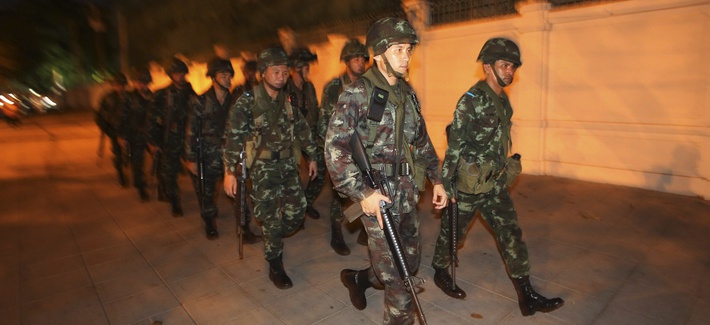 Thai soldiers patrol near an anti-government demonstration in Bangkok on May 22, 2014. Thai soldiers patrol near an anti-government demonstration in Bangkok on May 22, 2014.