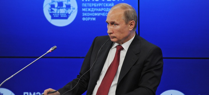 Russian President Vladimir Putin listens to a question during a plenary session of the St. Petersburg International Investment Forum Friday, May 23, 2014. Russian President Vladimir Putin listens to a question during a plenary session of the St. Petersburg International Investment Forum Friday, May 23, 2014.
