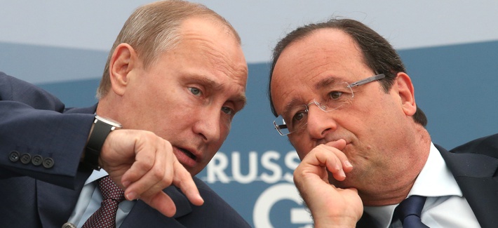 French President Francois Hollande, right, speaks with Russia's President Vladimir Putin during a meeting with G20 leaders in St. Petersburg, Russia on Sept. 6, 2013. 