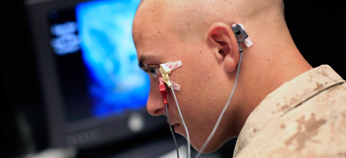 A Marine sits through an eye blink study with sensors attached to his face while taking psychological tests at the Marine Corps Air Ground Combat Center in Twentynine Palms, Calif., Sept. 29, 2009. 