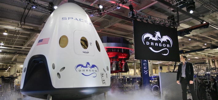 Elon Musk, right, unveils the SpaceX Dragon V2 spacecraft Thursday, May 29, 2014, in Hawthorne, Calif. Elon Musk, right, unveils the SpaceX Dragon V2 spacecraft Thursday, May 29, 2014, in Hawthorne, Calif.
