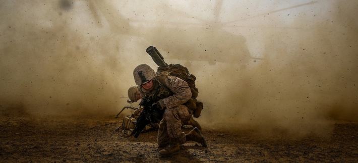 A Marine Corps corporal shields himself from dust kicked up by a CH-53E Super Sea Stallion lifting off during a mission in Helmand Province, Afghanistan, on April 28, 2014. A Marine Corps corporal shields himself from dust kicked up by a CH-53E Super Sea Stallion lifting off during a mission in Helmand Province, Afghanistan, on April 28, 2014.