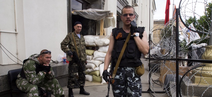 Pro-Russian insurgents stand guard in Luhansk, Ukraine, on May 25, 2014. Pro-Russian insurgents stand guard in Luhansk, Ukraine, on May 25, 2014.