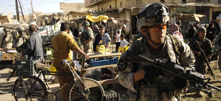 An Army specialist move through an open air market during a foot patrol in Baqubah, Iraq, on April 5, 2007. An Army specialist move through an open air market during a foot patrol in Baqubah, Iraq, on April 5, 2007.