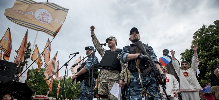 Pro-Russian gunmen react whie listening to a speaker as they declare independence for the Luhansk region in eastern Ukraine, on May 12, 2014. Pro-Russian gunmen react whie listening to a speaker as they declare independence for the Luhansk region in eastern Ukraine, on May 12, 2014.