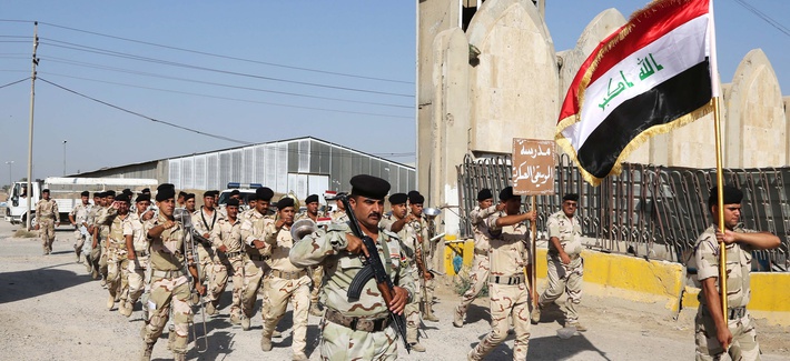 Members of the Iraqi Army march inside a recruiting center in Baghdad, Iraq, on June 19, 2014. Members of the Iraqi Army march inside a recruiting center in Baghdad, Iraq, on June 19, 2014.