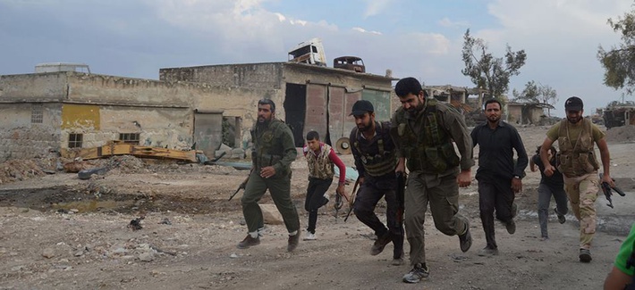 Free Syrian Fighters run at the front lines in the town of Sheikh Najjar, in Aleppo, Syria, on June 10, 2014. Free Syrian Fighters run at the front lines in the town of Sheikh Najjar, in Aleppo, Syria, on June 10, 2014.