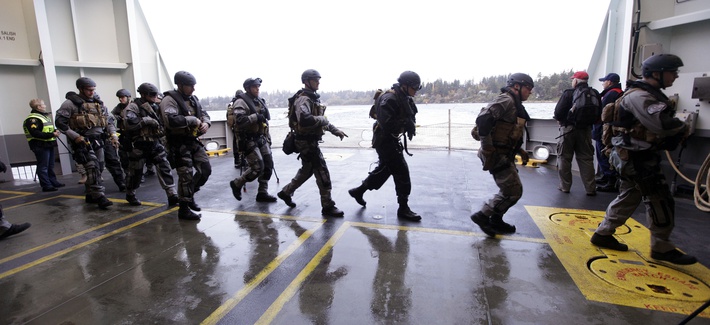 SWAT team members undertake training exercises on a Washington State ferry near, on October 29, 2012. SWAT team members undertake training exercises on a Washington State ferry near, on October 29, 2012.