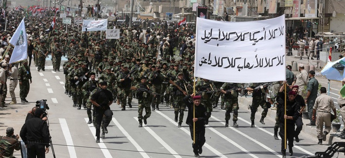 Volunteers of the newly formed "Peace Brigade" march in a demonstration in Sadr City, Baghdad, Iraq, on June 21, 2014. Volunteers of the newly formed "Peace Brigade" march in a demonstration in Sadr City, Baghdad, Iraq, on June 21, 2014.