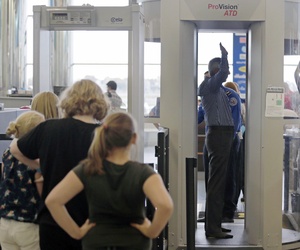 Passengers are scanned by TSA officers at a security checkpoint at Logan Airport in Boston, on October 24, 2012. Passengers are scanned by TSA officers at a security checkpoint at Logan Airport in Boston, on October 24, 2012.