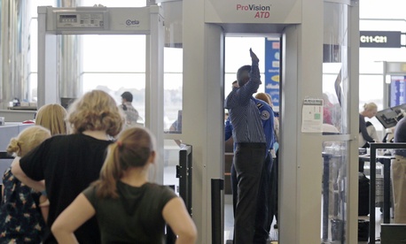 Passengers are scanned by TSA officers at a security checkpoint at Logan Airport in Boston, on October 24, 2012. Passengers are scanned by TSA officers at a security checkpoint at Logan Airport in Boston, on October 24, 2012.