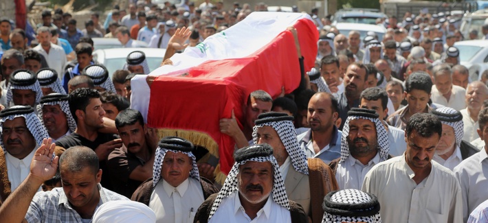 Mourners chant slogans against ISIL while carrying a coffin holding the body of a car-bomb victim, on April 24, 2014. Mourners chant slogans against ISIL while carrying a coffin holding the body of a car-bomb victim, on April 24, 2014.
