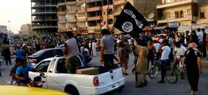 Fighters from the ISIL march during a parade in Raqqa, Syria, on June 30, 2014. Fighters from the ISIL march during a parade in Raqqa, Syria, on June 30, 2014.